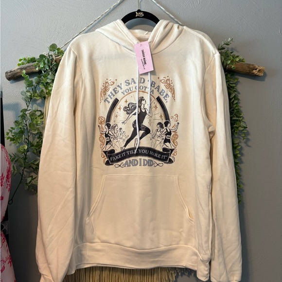 Sarah Marie Running Co Tops - Cream Hoodie with Running/Taylor Swift Themed Graphic